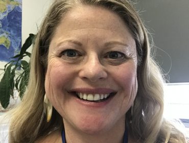 Photo of Dr Jane Frawley. She is smiling and has shoulder length blonde hair.